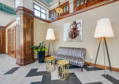 The Packard Motor Car Building apartment lobby with a 24/7 attendant featuring restored one-of-a-kind architectural elements